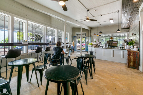 Woman working remotely in Old Road Coffee Shop in New Orleans LA